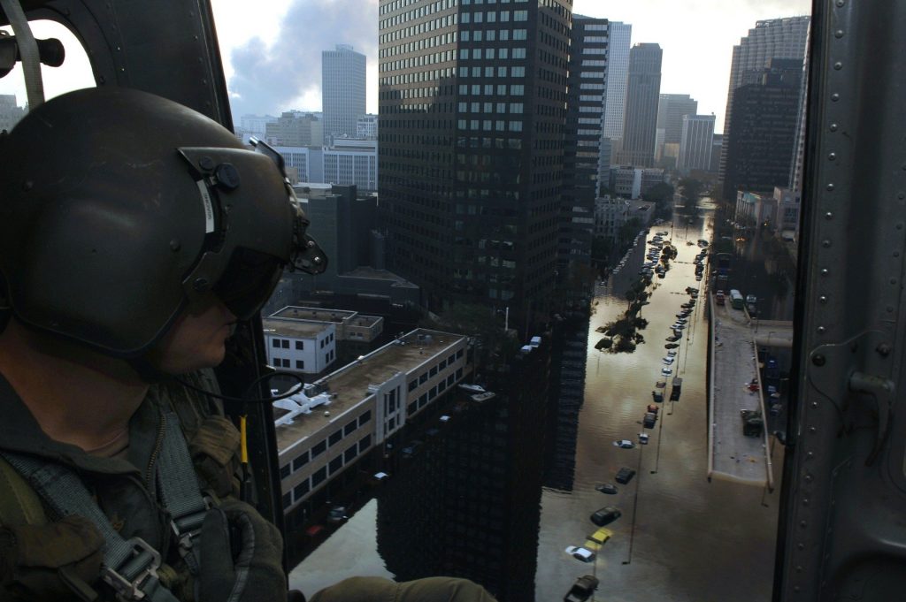 Officer Observing Hurricane Aftermath from Helicopter